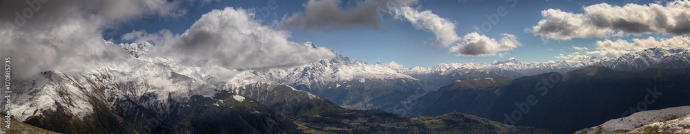 landscape, snow-capped peaks of the mountains of Svaneti in the clouds view of the valley, Svaneti, Georgia