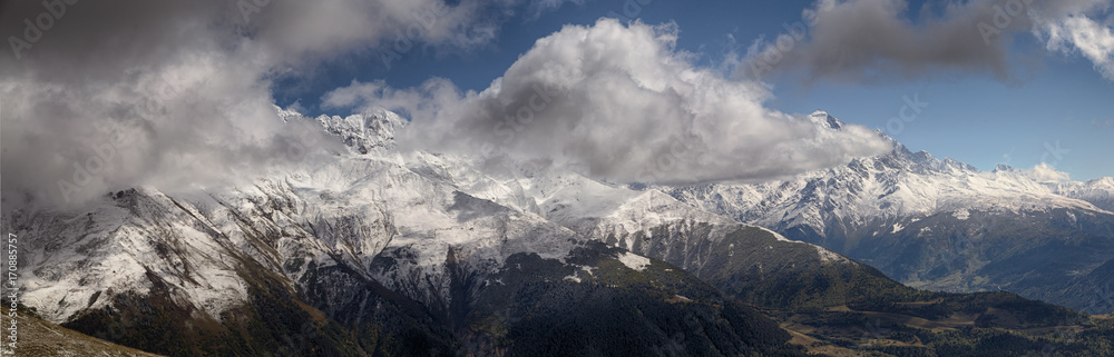 landscape, snow-capped peaks of the mountains of Svaneti in the clouds view of the valley, Svaneti, Georgia