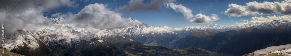 landscape, snow-capped peaks of the mountains of Svaneti in the clouds view of the valley, Svaneti, Georgia