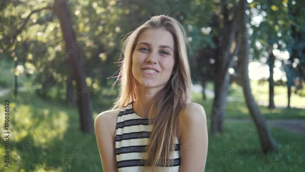 cute girl laughs with joy outdoors in the sunlight, student woman laughing after university lessons cute girl laughs with joy outdoors in the sunlight, student woman laughing after university lessons