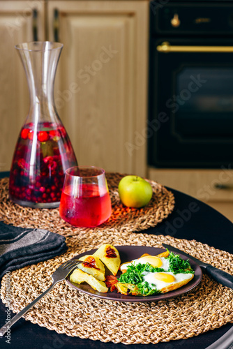 Breakfast with Scambled Eggs, and Infused Water with Berries. photo