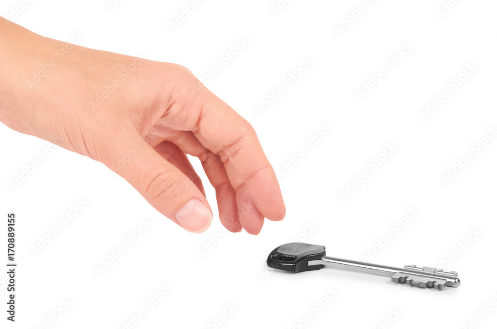 metal key with plastic handle in hand isolated on white background metal key with plastic handle in hand isolated on white background