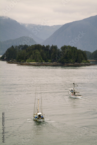 Fishing Boats Motoring in Sitka Harbor. Two fishing boats head home after a day of fishing out of Sitka Harbor. 