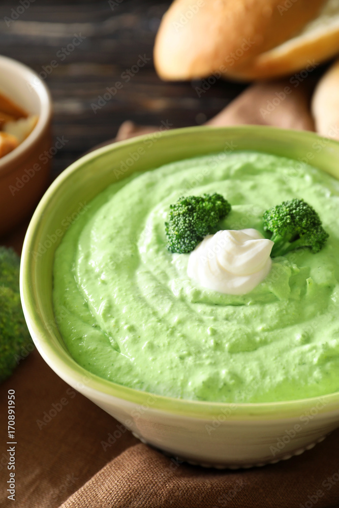 Bowl with tasty broccoli soup on table Bowl with tasty broccoli soup on table