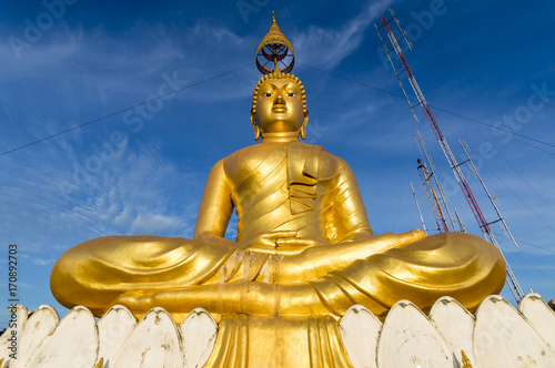 Big gold Buddha statue at the sunrise in Tiger Cave Temple in Krabi province  Thailand 