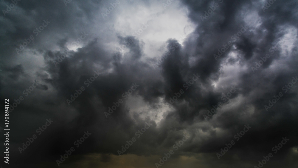 Beautiful summer day storm cloud with sun shining. Dramatic thunderstorm cloudscape with large, building clouds, natural rainy dark sky, perfect for posters background. Beautiful summer day storm cloud with sun shining. Dramatic thunderstorm cloudscape with large, building clouds, natural rainy dark sky, perfect for posters background.