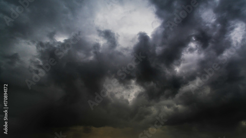 Beautiful summer day storm cloud with sun shining. Dramatic thunderstorm cloudscape with large, building clouds, natural rainy dark sky, perfect for posters background.