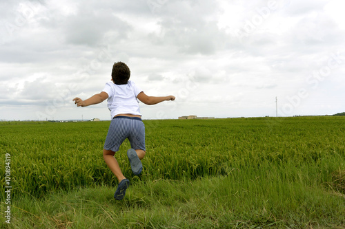 Boy and green field...