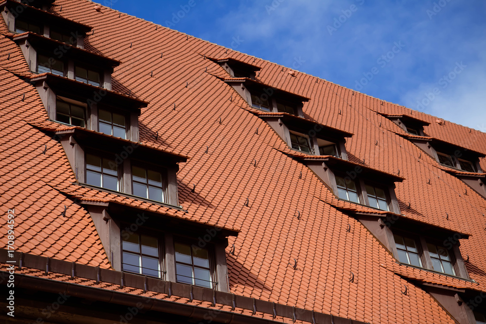 Characteristic roof windows, typical for architecture in Germany, on a building in Nuremberg Characteristic roof windows, typical for architecture in Germany, on a building in Nuremberg