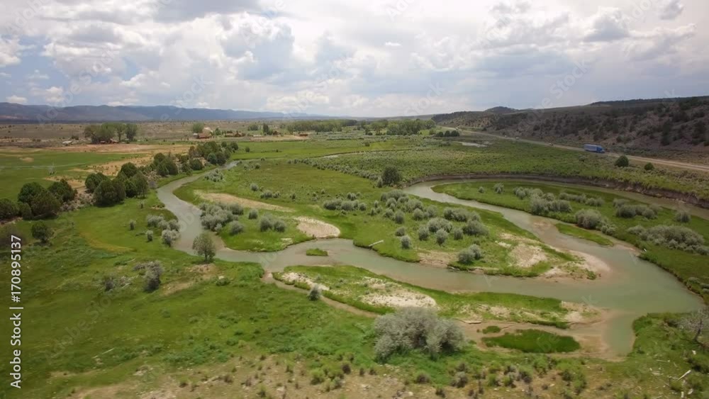 Winding River in Meadow Aerial Shot Winding River in Meadow Aerial Shot
