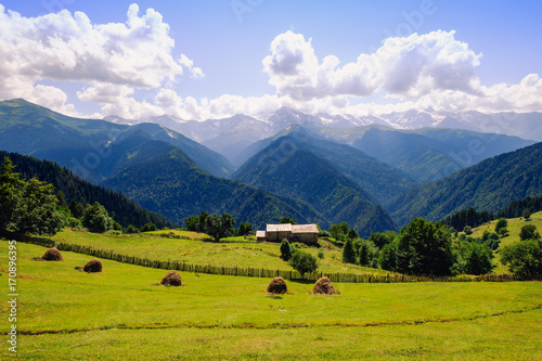 Landscape view of mountains, meadows and cottage in Svaneti national park, Georgia