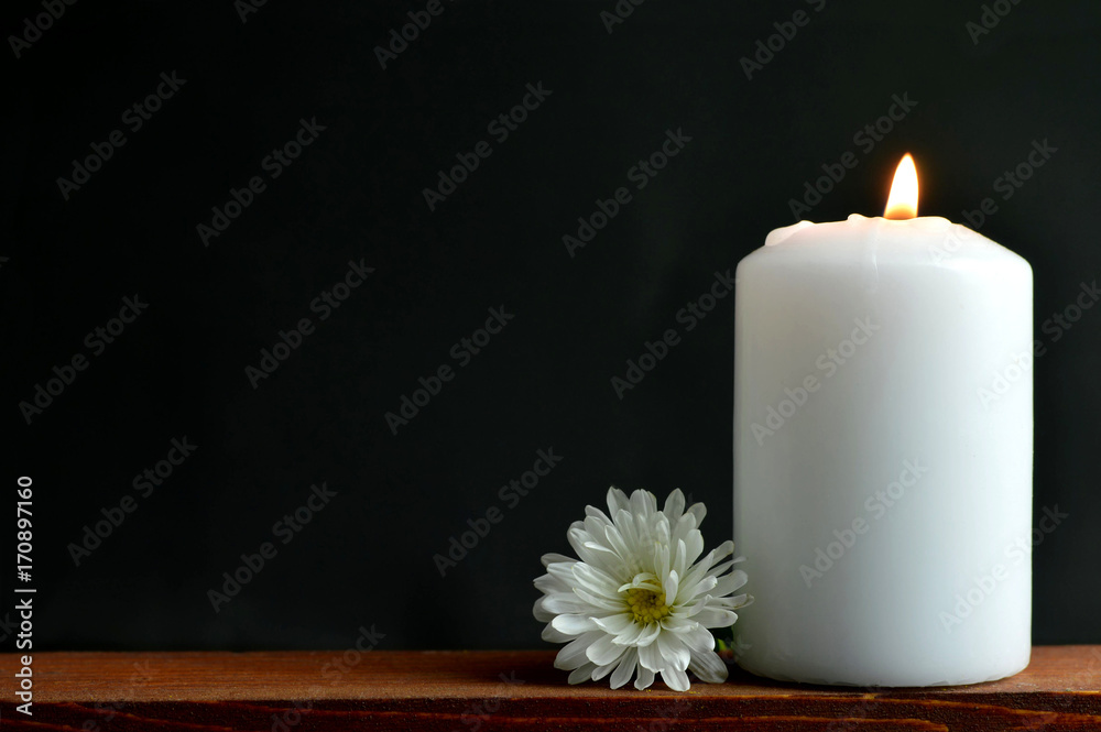 Fototapeta premium Condolence card with white burning candle and flower