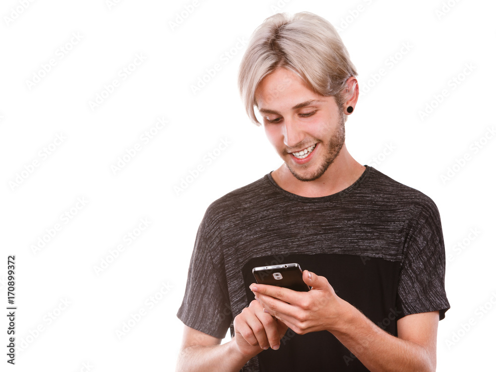 Young man using mobile phone texting on smartphone Young man using mobile phone texting on smartphone