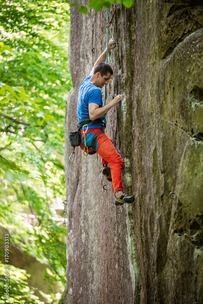 Rock climber on challenging route