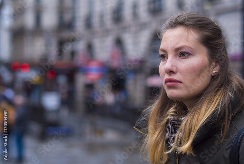 Portrait of a young blonde woman in a big city © 4kclips