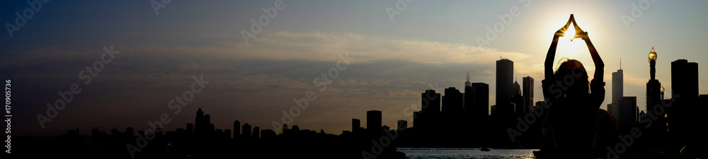 chicago skyline sunset with yoga silhouette