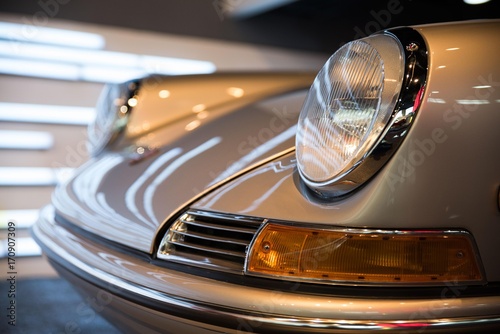 A classic Porsche with headlights that look like a frog's eyes.