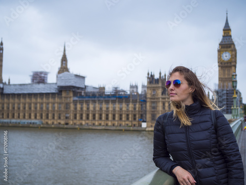 Young blonde girl in London - Westminster Bridge and Houses of Parliament