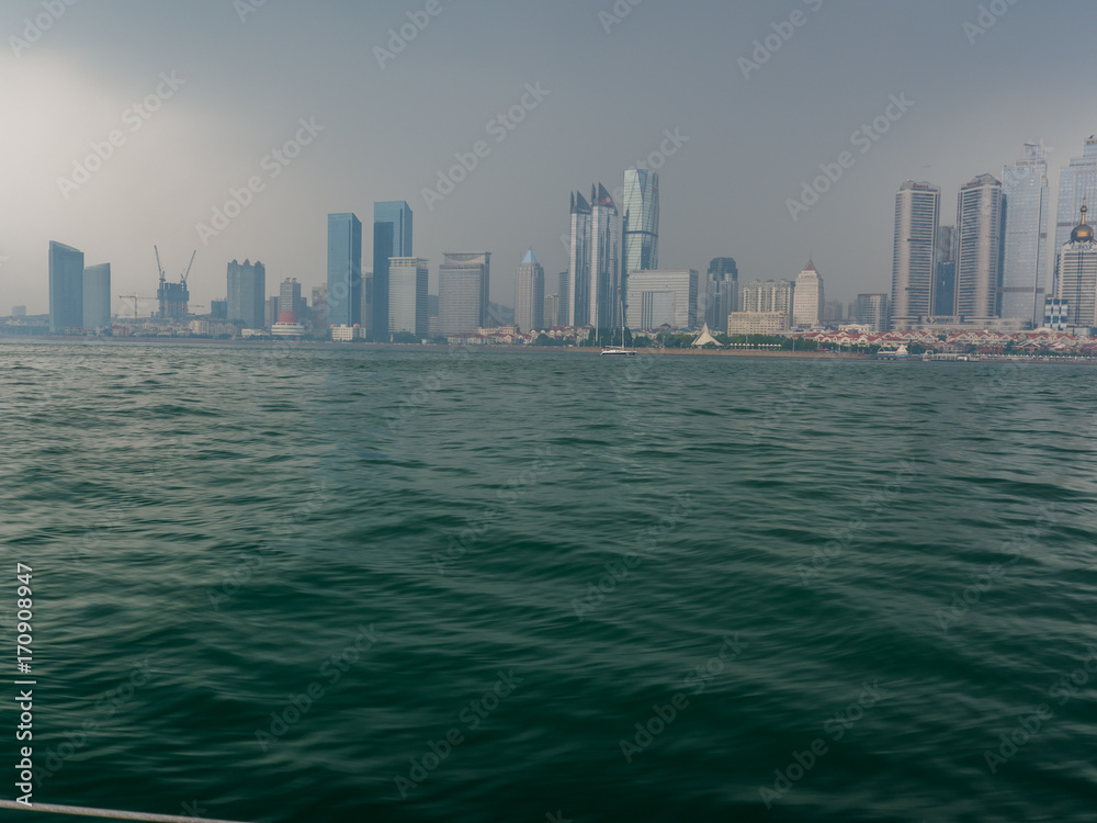 Urban architecture over sea with reflection.