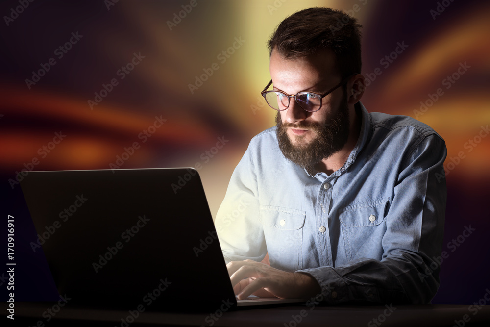 Businessman in the office at night