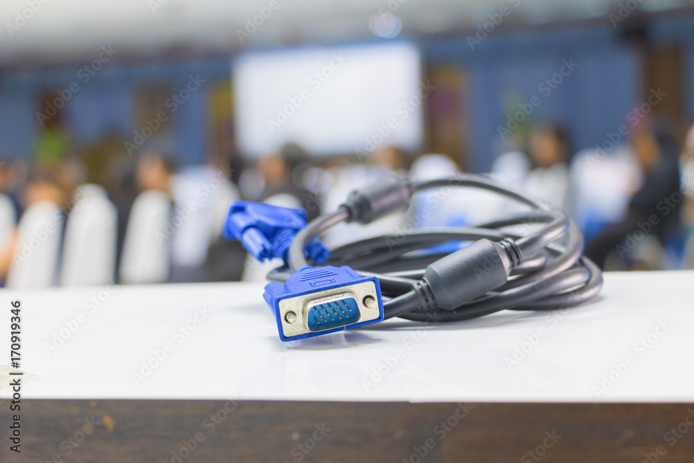 Obraz premium old dirty VGA tech cable connector of computer on table white Blur meeting room background