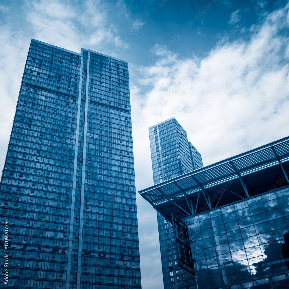 Fototapeta premium architectural complex against sky in downtown tianjin,china.blue toned.