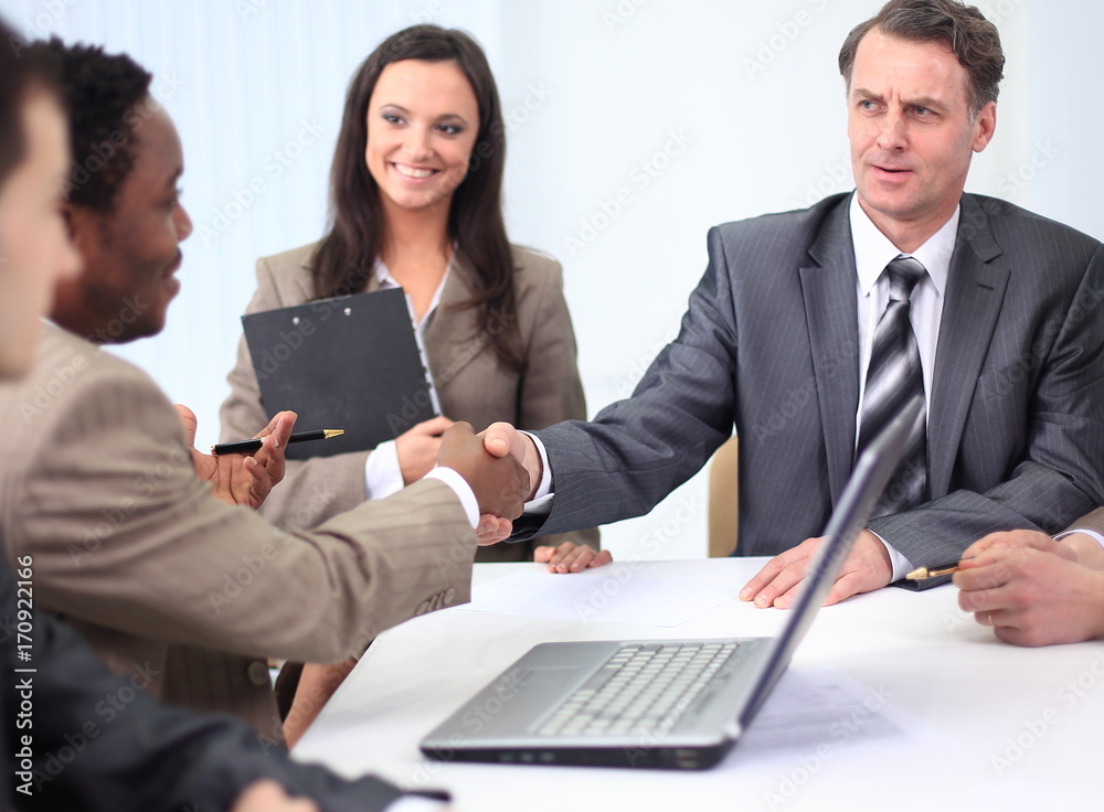 handshake business partners at a business meeting handshake business partners at a business meeting