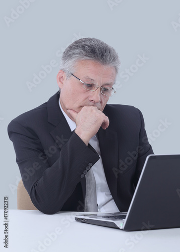 Portrait of a mature gray-haired business man isolated on white