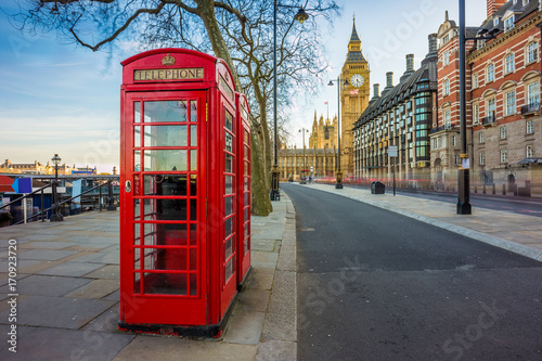 London, England - Traditional Old British red telephone box at Victoria Embankment with Big Ben at background © zgphotography