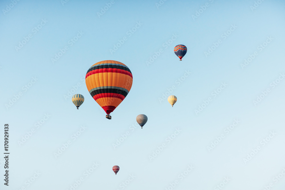 A group of colorful hot air balloons against A group of colorful hot air balloons against