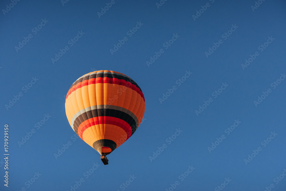 A group of colorful hot air balloons against A group of colorful hot air balloons against
