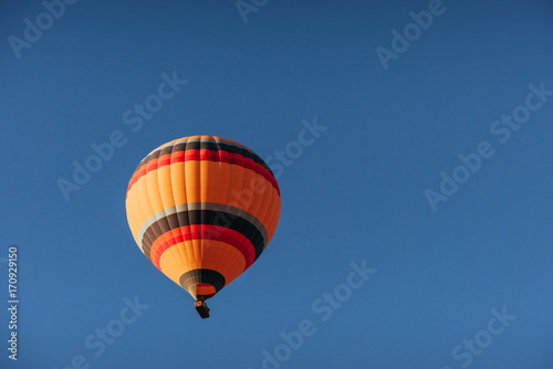 A group of colorful hot air balloons against © standret
