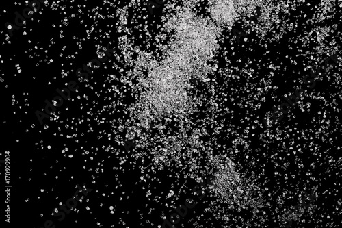 White crystal sugar pile isolated on black background and texture, top view