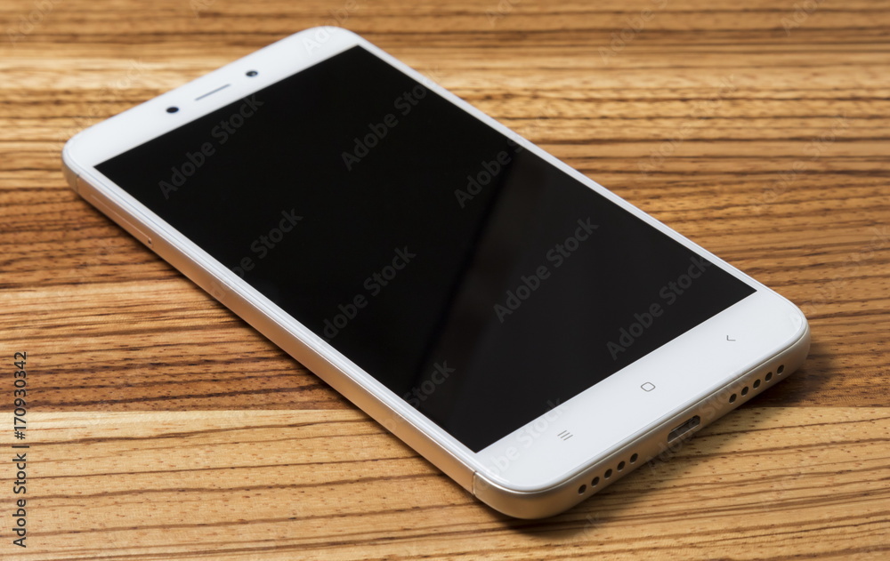 Smartphone on wooden background Smartphone on wooden background