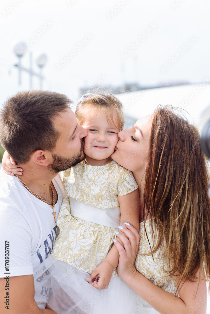 Happy loving family. portrait of mom with dad and daughter Happy loving family. portrait of mom with dad and daughter