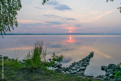 Obraz na płótnie Romantic Stone dock, walkway in a lake at a sunset, Uveldy, The Urals, Russia w salonie