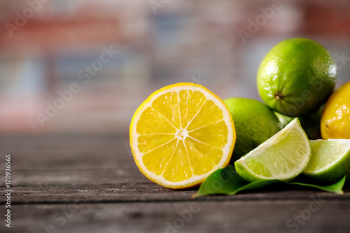 Stack of citrus fruits sliced. lemons and limes.
