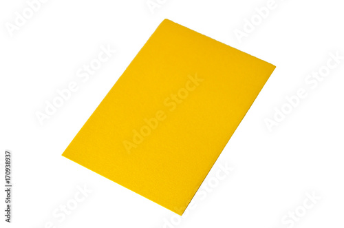 Yellow colored note paper shot on white background.
