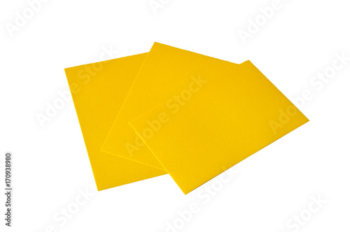 Yellow colored note papers shot on white background.
