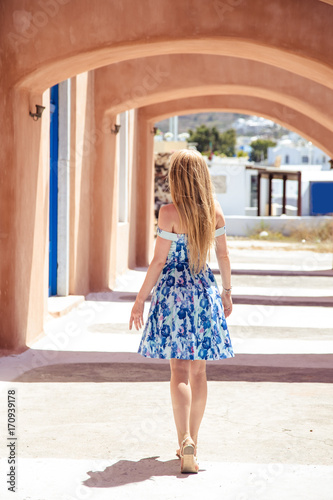 Beautiful blonde woman in a summer blue dress in a south europe Free Download Beautiful blonde woman in a summer blue dress in a south europe - GFXLoad