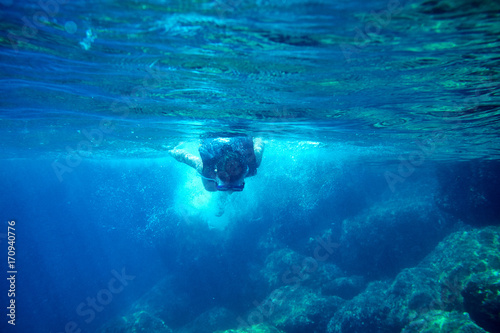 Girl snorkeling in the sea. © ZoomTeam