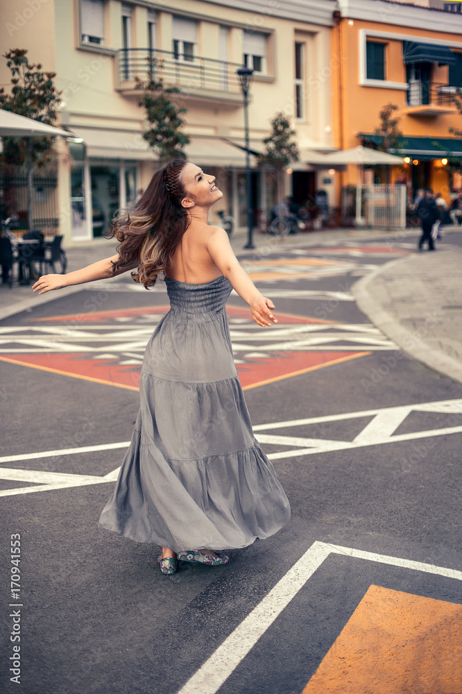 Happy emotional portrait. Young woman enjoying summer. Tirana city center. 