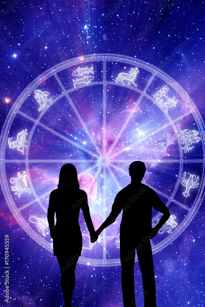 Obraz premium a couple silhouette in front of zodiac wheel with zodiacal symbols like a concet astrology and love