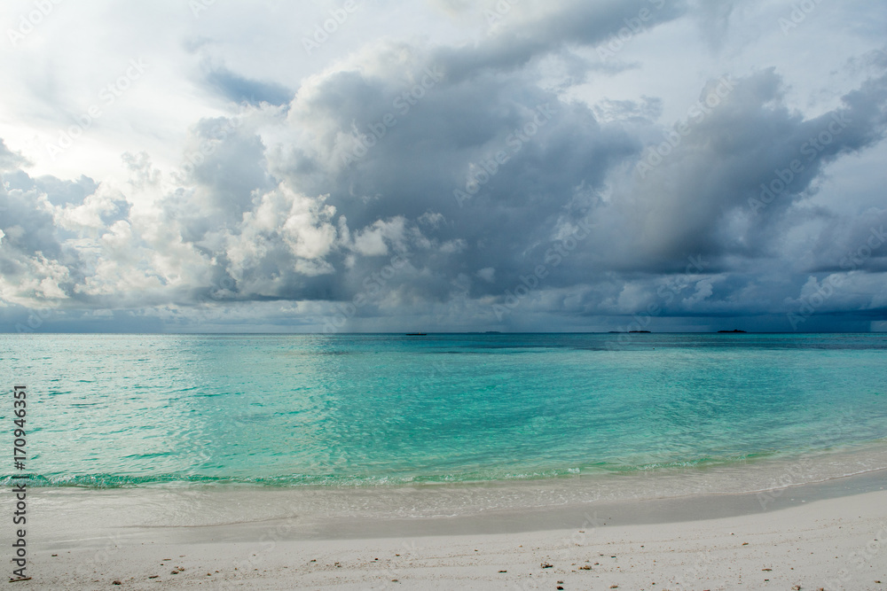 Cloudy landscape of Indian ocean sandy beach  before the storm