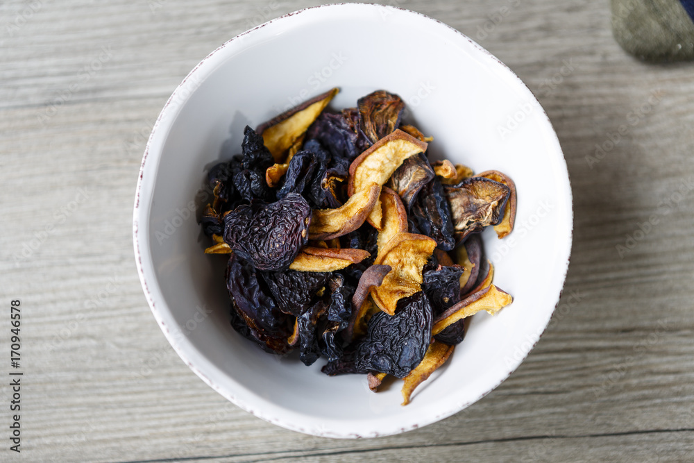 dry fruit in white bowl on wooden floor or table dry fruit in white bowl on wooden floor or table