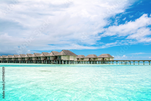 Fototapeta Naklejka Na Ścianę i Meble -  Wooden villas over water of the Indian Ocean, Maldives