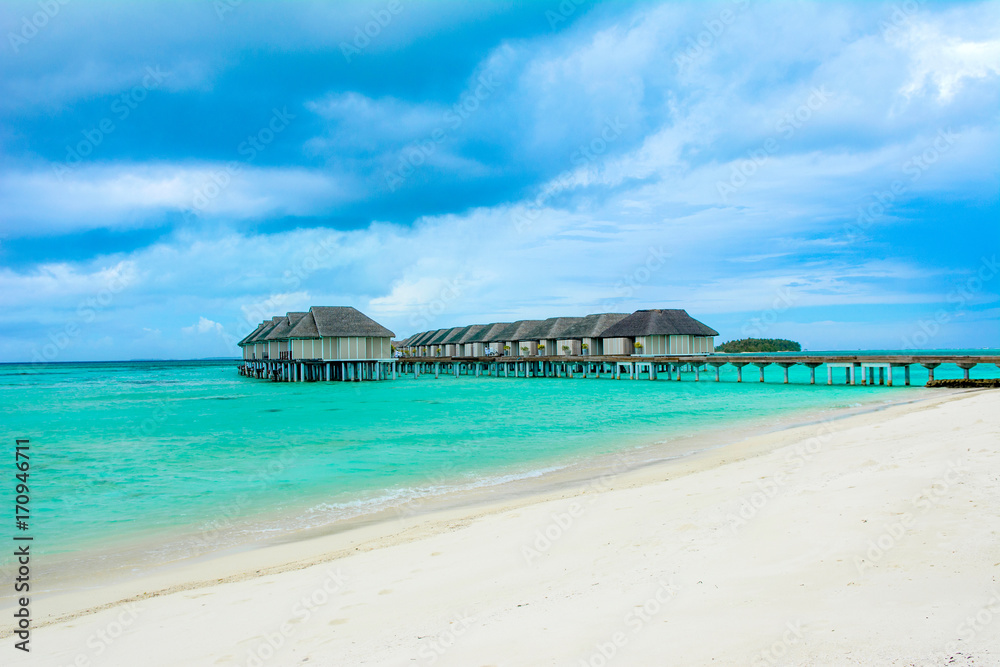 Wooden villas over water of the Indian Ocean, Maldives Wooden villas over water of the Indian Ocean, Maldives
