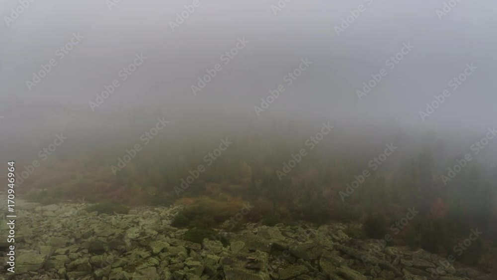 Fog and clouds over rocks and forest in the mountains in autumn. 4K time lapse.
Fog and clouds over rocks and forest in the mountains in autumn. 4K time lapse.