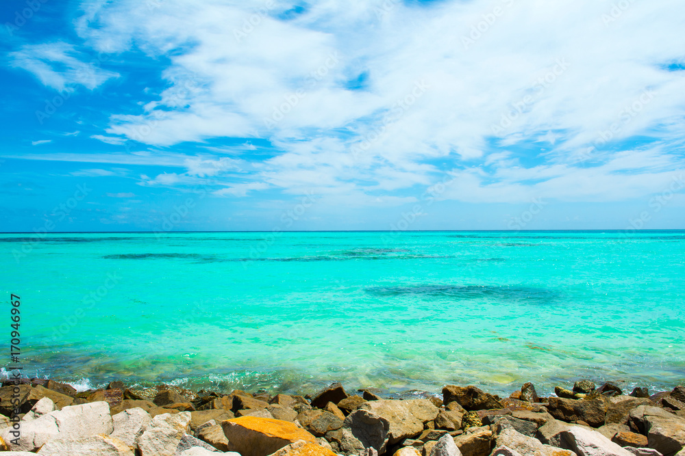 Beautiful landscape of rocky beach with clear turquoise Indian ocean, Maldives islands