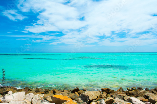 Beautiful landscape of rocky beach with clear turquoise Indian ocean, Maldives islands